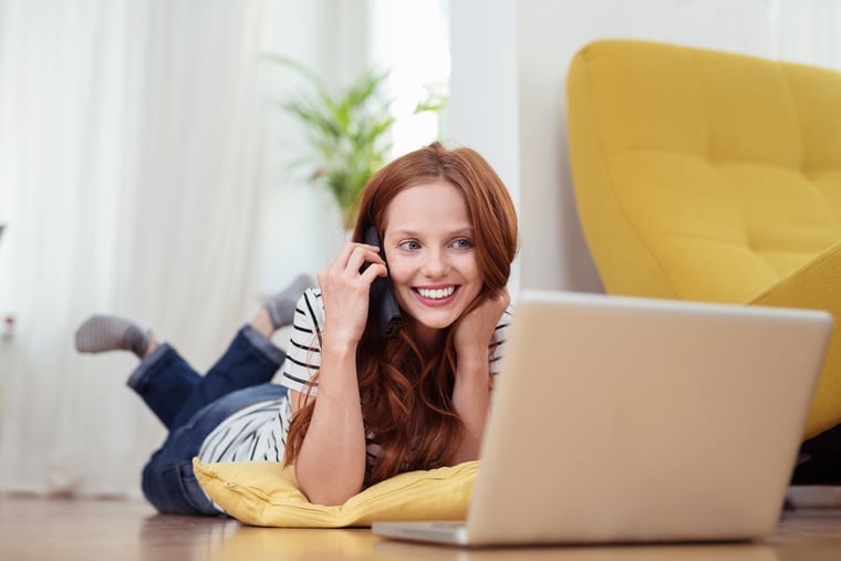 Person smiling on the phone