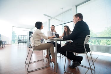 Four people sitting at table