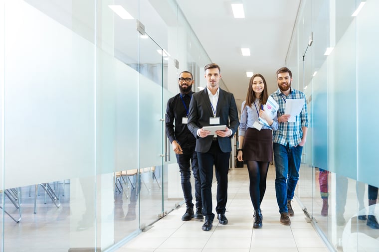 coworkers walking in a hallway