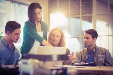 Coworkers working together at desk