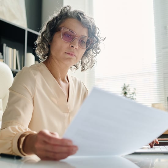 Female chief financial officer studies financial documents