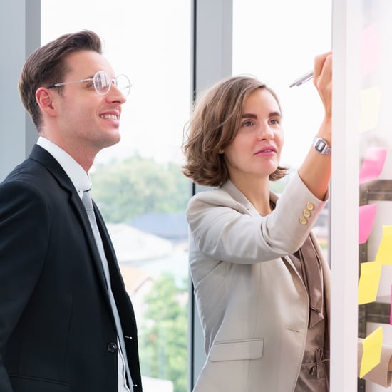 man and women holding a strategy session