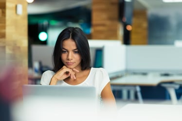 Person doing payroll at computer