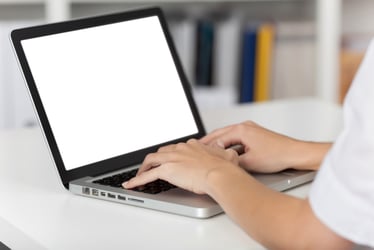 Person hands typing on a keyboard