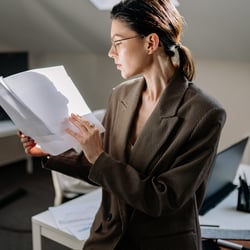 Woman reviewing employee files in an office