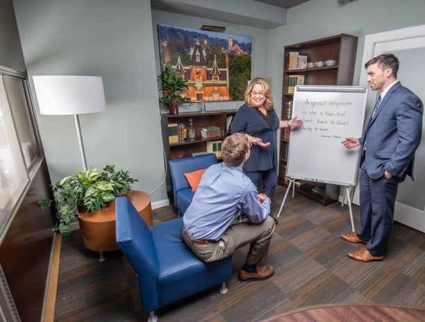 Team members gathered in a meeting. 