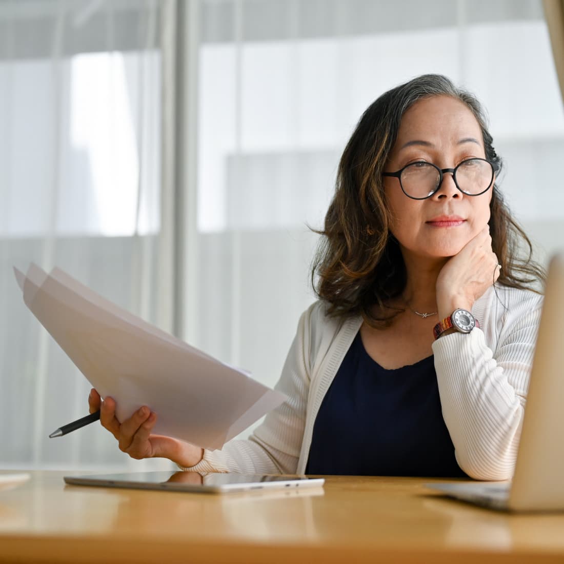 Business woman reviewing documents. 