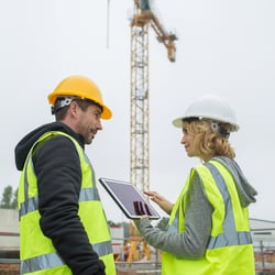 man and woman construction workers on a job site