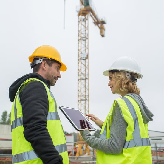 man and woman construction workers on a job site